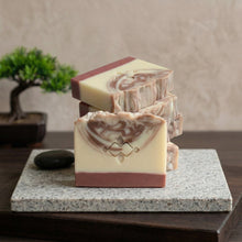 Load image into Gallery viewer, Handmade sandalwood natural soap bar with creamy ivory base, brown swirl top, and stacked matching bars