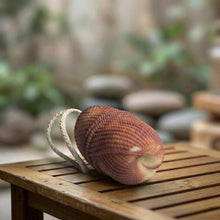 Load image into Gallery viewer, Sandalwood soap on a rope, textured handmade wash bar shown on its side