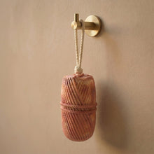 Load image into Gallery viewer, Hanging sandalwood soap on a rope, textured handmade body bar shown upright