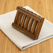 Load image into Gallery viewer, Side angle of natural wooden soap tray standing vertically on its edge.