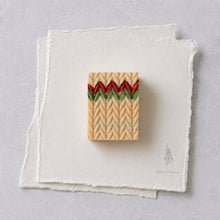 Charger l'image dans la galerie, Single handmade Christmas sweater soap bar with cream knit texture and festive red and green zigzag stripe