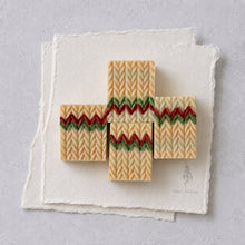 Charger l'image dans la galerie, Four handmade Christmas sweater soap bars arranged in a cross with cream, red and green knit patterns