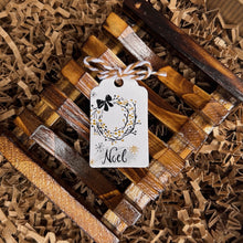 Load image into Gallery viewer, French Noël gift tag displayed on the wooden soap dish inside the kraft Christmas gift box.