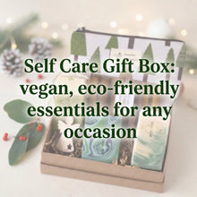 Load image into Gallery viewer, Vegan bath and body gift set with three handcrafted soaps, wooden soap dish, seasonal tree-print pouch and a wooden angel. Packed in crinkle paper and kraft box.