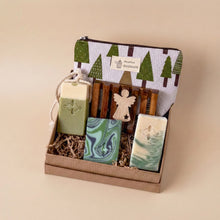 Load image into Gallery viewer, Vegan bath and body gift set with three handcrafted soaps, wooden soap dish, tree-print pouch and a wooden angel. Packed in crinkle paper and kraft box.