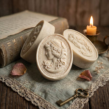 Load image into Gallery viewer, Three ivory oval cameo soaps with raised woman portrait relief, handmade vintage bars