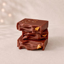 Charger l'image dans la galerie, Three stacked brown Christmas Eve soap bars with sculpted tops and dried orange accents