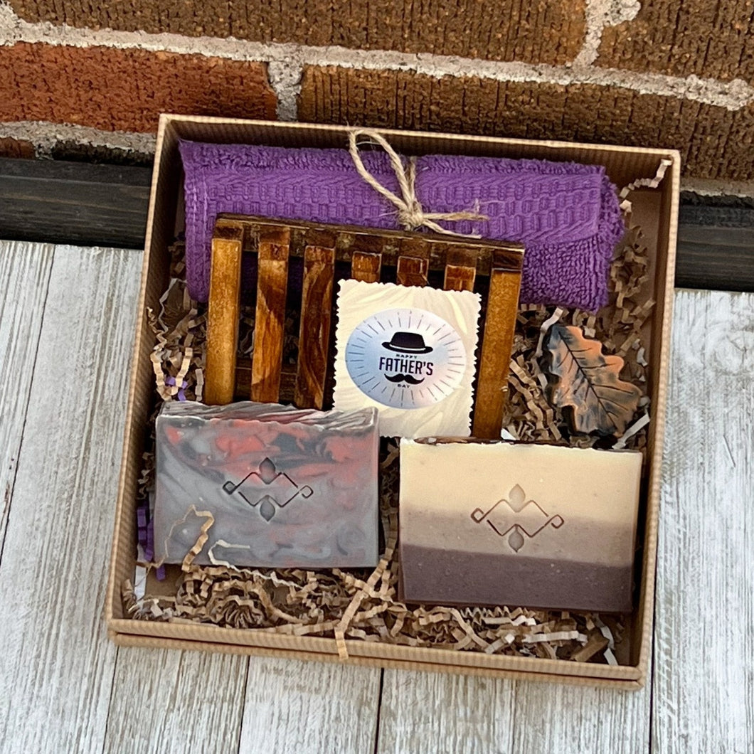 Men’s spa gift box with two artisan soaps, wooden soap tray, purple cloth – handmade Father’s Day self‑care set.