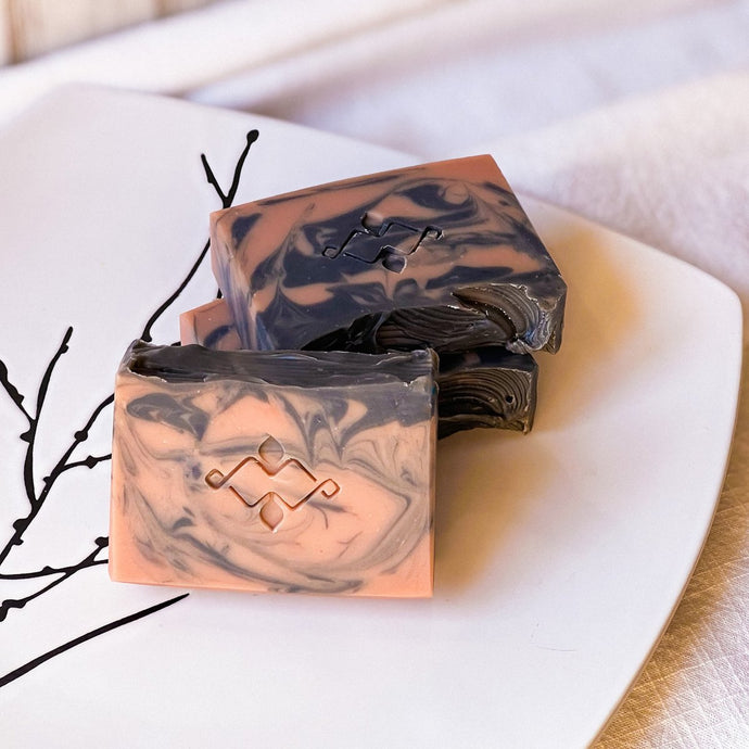 Premium natural soap bar with vibrant swirls, crafted with plant-based oils and sustainable methods by Woods and Mosses.